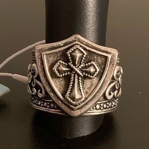 NWT Stigma silver tone ring size 9. Cross emblem.